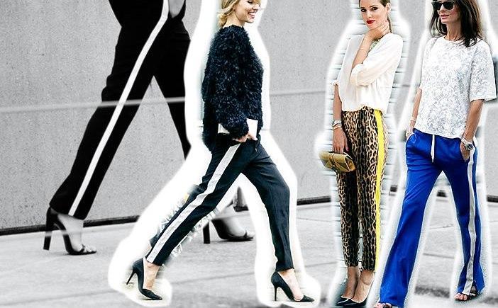 Tres mujeres con pantalones con franjas laterales caminando en ciudad, moda urbana y elegante